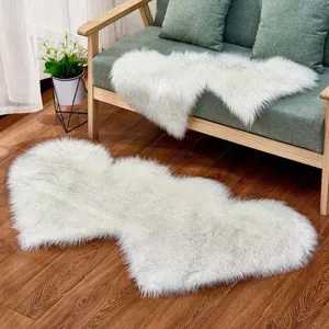 Close-up detail of fluffy white imitation wool heart-shaped rug, soft plush home decor mat.