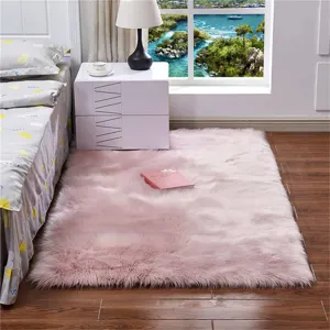 Tapis en fausse laine rose doux pour chambre et salon, tapis de chevet duveteux et chic.
