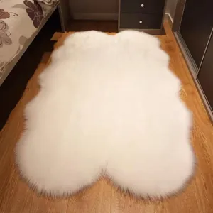White faux sheepskin plush rug detail view, soft fluffy long hair bedside floor mat for bedroom.