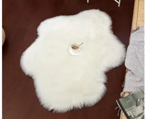 Detailed view of a soft white plush cloud-shaped rug showcasing cozy texture on wood floor.