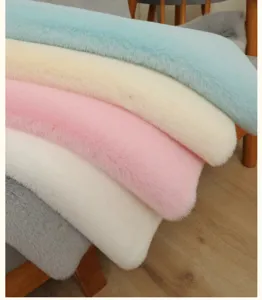 Close-up detail of soft fluffy plush bedside rug strip, comfortable texture, cozy bedroom decor.