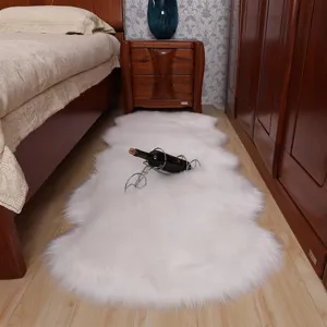 Detailed view of fluffy white faux sheepskin rug in a cozy bedroom scene, soft texture.