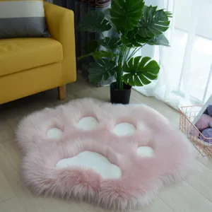 Soft pink cat paw plush rug detail, fluffy texture for cozy bedroom or living room decor.