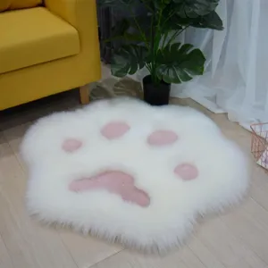 Soft white fluffy cat paw rug with pink pads, perfect cute floor mat for bedroom or living room.