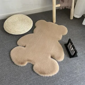 Cute beige bear-shaped plush rug, soft faux rabbit fur floor mat for bedroom and kids room.
