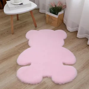 Detailed shot of the cute pink bear plush rug in a cozy bedroom decor setting, soft texture.