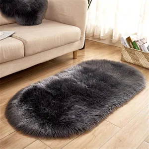 Dark grey oval faux wool fluffy rug, soft plush carpet for living room sofa bedroom floor.