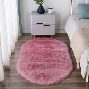 Fluffy pink oval area rug, soft plush bedside carpet for bedroom, anti-slip floor mat home decor.