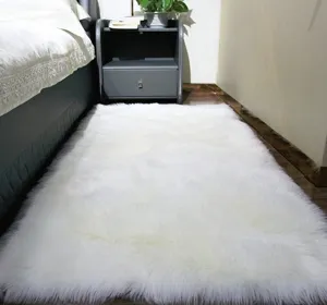 White fluffy faux fur rug for bedroom bedside, soft plush shag carpet for living room decor.