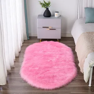 Pink oval fluffy plush rug, soft faux fur bedside carpet, anti-slip floor mat for bedroom.
