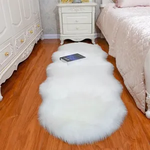 White faux sheepskin fluffy rug detail, soft long plush bedside carpet for bedroom home decor.