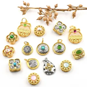 Detailed view of ancient gold style vajra and gemstone inlaid jewelry accessories and beads.