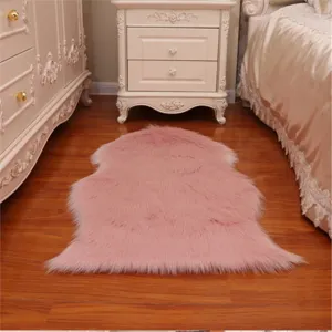 Pink faux fur sheepskin rug, soft fluffy bedside carpet for bedroom living room floor decor.