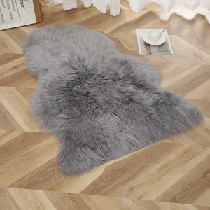 Fluffy grey faux sheepskin rug soft furry mat for living room bedroom floor decor.