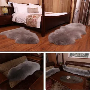 Detail shot of fluffy grey sheepskin rug and sofa mat, natural fur texture for cozy home decor.