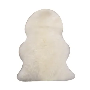Luxurious genuine Australian sheepskin rug, fluffy white fur mat for living room sofa, cozy floor carpet.