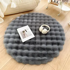Fluffy round faux rabbit fur rug detail, cozy cream style bedside floor mat for living room.