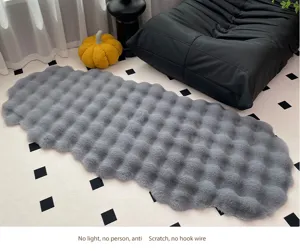 Detailed view of cozy grey bubble plush cushion, soft fluffy texture home decor detail.