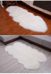 White faux fur rug detail shot, fluffy irregular plush floor mat for bedroom or living room decor.