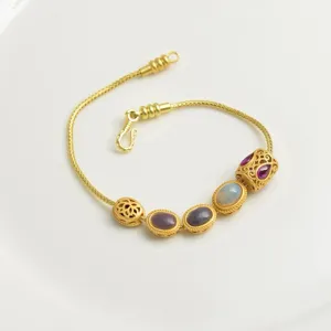 Exquisite antique gold DIY snake chain bracelet featuring ornate filigree beads and colorful gemstones.