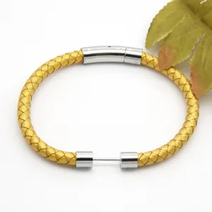 Yellow braided leather bracelet with stainless steel magnetic clasp, stylish fashion jewelry.