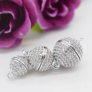Close up detail of sparkling rhinestone micro pave magnetic ball clasps for DIY jewelry making.
