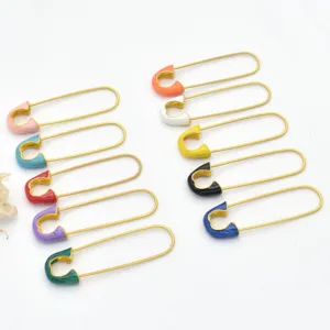 Colorful enamel safety pins for DIY jewelry making, gold-toned metal craft accessories.