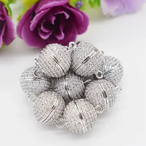 Detailed shot of sparkling micro-pave zircon magnetic ball clasps for DIY jewelry making.