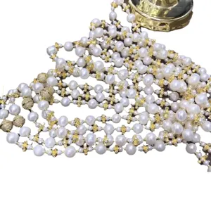 Multi-strand pearl necklaces with gold cross spacers and rhinestone magnetic clasps