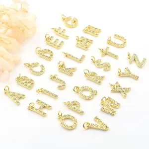 Detail view of 26 English letter micro pave zircon charms, gold plated DIY jewelry making.