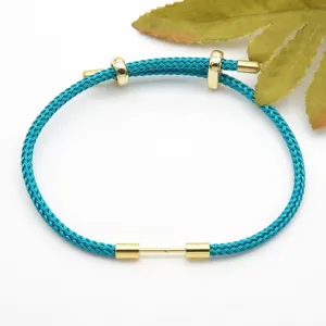Turquoise braided cord bracelet with gold metal slider beads, adjustable fashion accessory