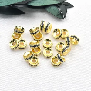 Gold-plated rhinestone spacer beads micro-inlaid with blue zirconia for DIY jewelry making detail.