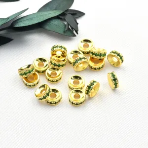 Gold-plated round rhinestone spacer beads for DIY jewelry making and bracelet design details.