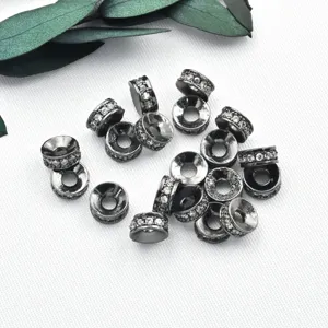 Detail shot of micro-paved cubic zirconia round spacer beads, gunmetal plated DIY parts.