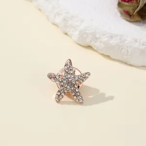 Exquisite rhinestone starfish brooch pin, elegant sparkling crystal lapel accessory for women.