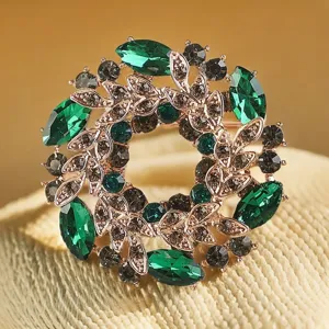 Vintage green crystal wreath brooch, elegant rose gold tone lapel pin for suit jacket and dress.