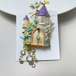 Close-up view of the vintage fairy tale castle brooch with crystal rhinestones and sparkling tassel chains.