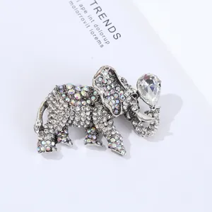 Rhinestone elephant brooch detail shot, sparkling crystal alloy animal fashion pin accessory.