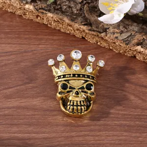 Vintage alloy rhinestone skull crown brooch detailed shot showcasing gothic Halloween jewelry design.