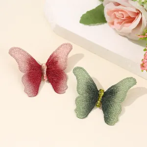 Exquisite embroidered butterfly brooch set, vintage mesh fabric design, elegant apparel accessory.
