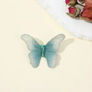 Vintage blue butterfly embroidery brooch for women, elegant fabric pin accessory for daily wear.