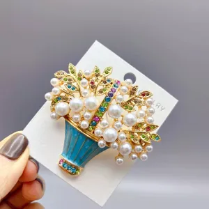 Vintage flower basket brooch detail with elegant pearls and colorful crystal rhinestones.