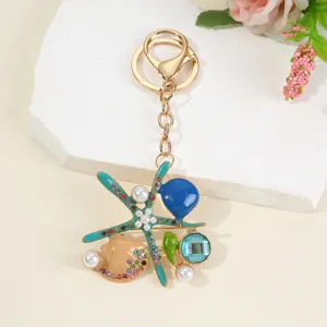 Zee schelp zeester sleutelhanger legering tas bedel met kleurrijke strass steentjes detail.