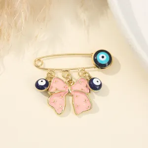 Gold evil eye bow safety pin brooch aesthetic fashion jewelry for women and girls