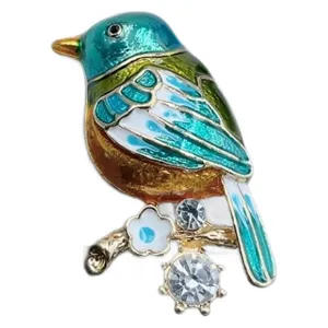 Charming enamel bird brooch with sparkling rhinestones, elegant coat pin accessory.