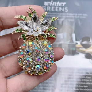 Close-up detail of the luxury crystal rhinestone pineapple brooch sparkling alloy jewelry piece.
