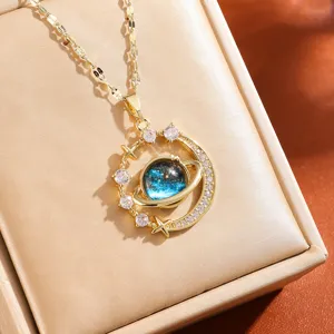 Exquisite gold-plated planet necklace with galaxy glass pendant and sparkling crystal stars.