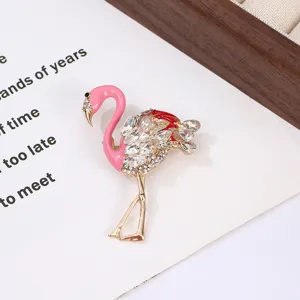 Exquisite flamingo brooch crafted from alloy with vibrant pink enamel and sparkling rhinestones.