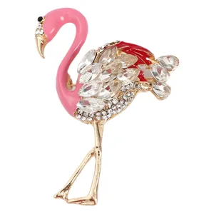 Exquisite crystal flamingo brooch with pink and red enamel accents on alloy base.