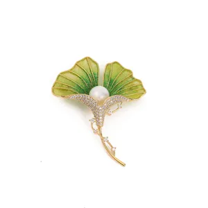 Exquisite ginkgo leaf brooch detail, green enamel and dazzling rhinestones with a central pearl.